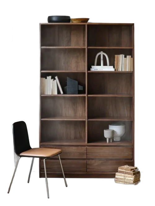 Tall walnut-finish bookshelf with a black chair and a stack of books